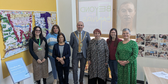 Photo caption: (second left) Cllr Maggie O'Rourke, Rugby Borough Council portfolio holder for partnerships and wellbeing, and (centre) the Mayor of Rugby, Cllr Simon Ward, joined members of the Houlton WI at the International Women's Day display at Rugby Art Gallery and Museum.